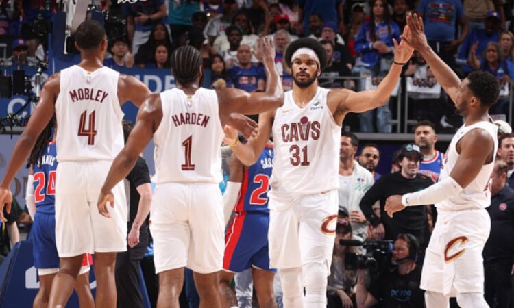 Evan Mobley #4, James Harden #1, Jarrett Allen #31, and Donovan Mitchell #45 of the Cleveland Cavaliers celebrate during Game 7 of the Eastern Conference Second Round playoffs against the Detroit Pistons at Little Caesars Arena on May 17, 2026.