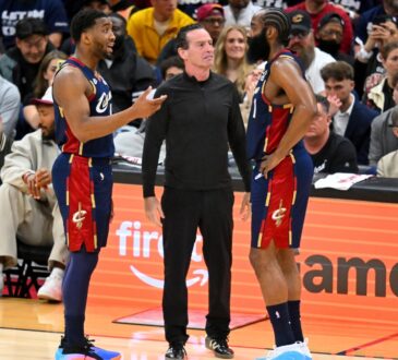 Donovan Mitchell and head coach Kenny Atkinson talk to James Harden during Game 1 of the Eastern Conference First Round NBA Playoffs at Rocket Arena.
