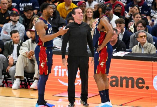 Donovan Mitchell and head coach Kenny Atkinson talk to James Harden during Game 1 of the Eastern Conference First Round NBA Playoffs at Rocket Arena.