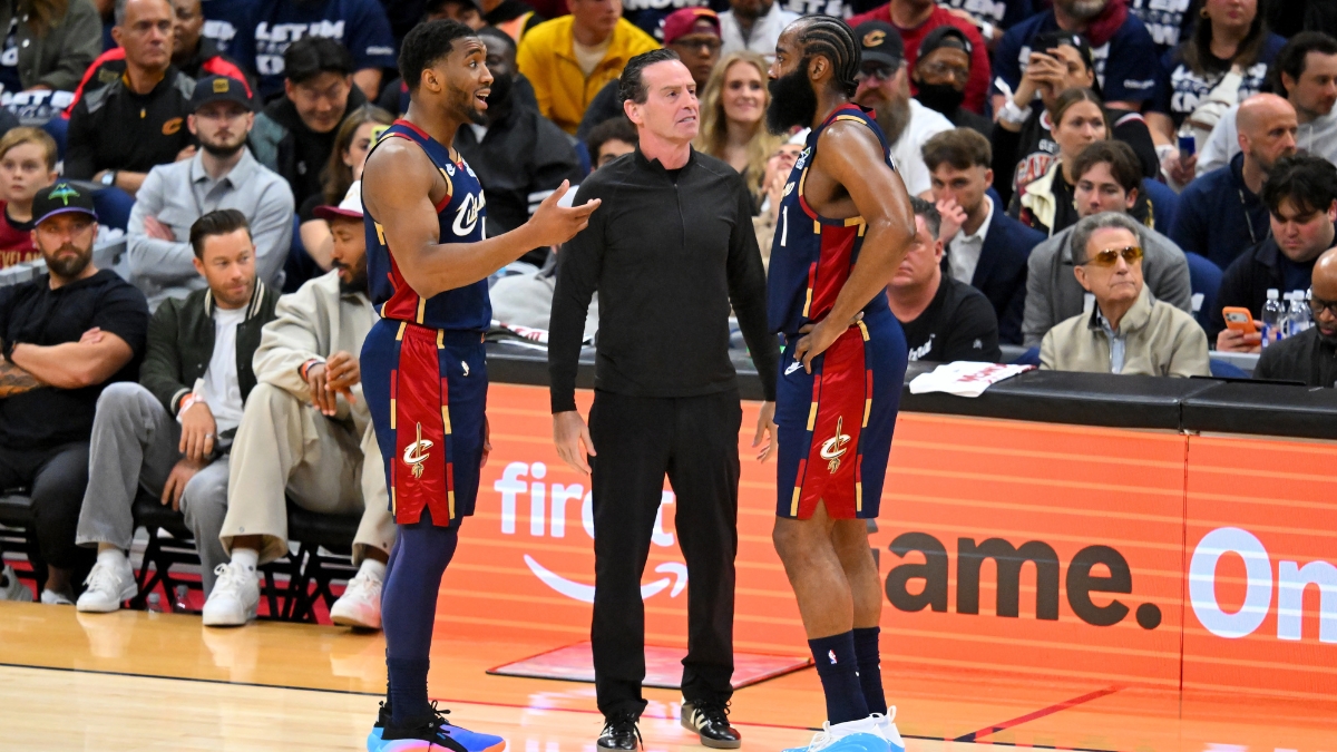 Donovan Mitchell and head coach Kenny Atkinson talk to James Harden during Game 1 of the Eastern Conference First Round NBA Playoffs at Rocket Arena.