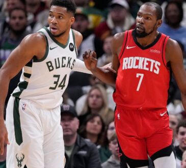 Giannis Antetokounmpo #34 of the Milwaukee Bucks defends Kevin Durant #7 of the Houston Rockets during a game at Fiserv Forum.