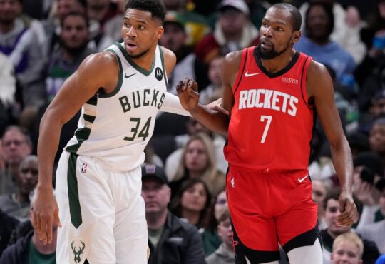 Giannis Antetokounmpo #34 of the Milwaukee Bucks defends Kevin Durant #7 of the Houston Rockets during a game at Fiserv Forum.