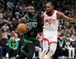 Jaylen Brown #7 of the Boston Celtics drives to the basket against Kevin Durant #7 of the Houston Rockets at TD Garden.