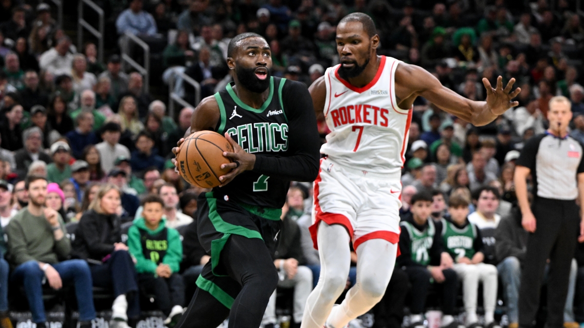 Jaylen Brown #7 of the Boston Celtics drives to the basket against Kevin Durant #7 of the Houston Rockets at TD Garden.