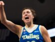 Dallas Wings forward Jessica Shepard flexing and celebrating on court during a game against the Las Vegas Aces at College Park Center.