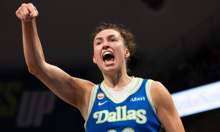 Dallas Wings forward Jessica Shepard flexing and celebrating on court during a game against the Las Vegas Aces at College Park Center.