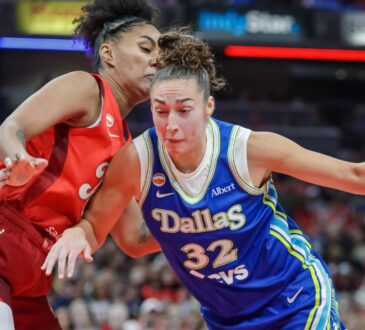 Jessica Shepard (32) of the Dallas Wings drives to the basket against Damiris Dantas (12) of the Indiana Fever.