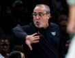 Head coach Jose Fernandez shouting instructions and gesturing toward his players from the sideline at Barclays Center.