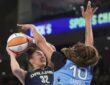 Chicago center Kamilla Cardoso extending her arm to block a low-post shot attempt by Dallas forward Jessica Shepard during the first half.