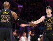 LeBron James #23 and Austin Reaves #15 of the Los Angeles Lakers high five during the fourth quarter of Game 4 of the Western Conference Second Round against the Oklahoma City Thunder at Crypto.com Arena on May 11, 2026.