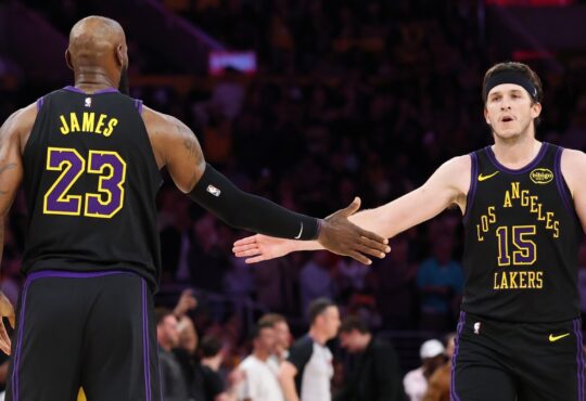 LeBron James #23 and Austin Reaves #15 of the Los Angeles Lakers high five during the fourth quarter of Game 4 of the Western Conference Second Round against the Oklahoma City Thunder at Crypto.com Arena on May 11, 2026.