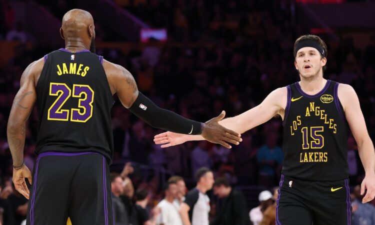 LeBron James #23 and Austin Reaves #15 of the Los Angeles Lakers high five during the fourth quarter of Game 4 of the Western Conference Second Round against the Oklahoma City Thunder at Crypto.com Arena on May 11, 2026.