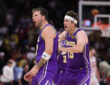 Austin Reaves #15 and Luka Doncic #77 of the Los Angeles Lakers celebrate during the second half against the Houston Rockets at Toyota Center on March 18, 2026.