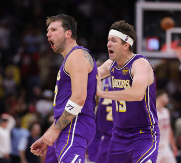 Austin Reaves #15 and Luka Doncic #77 of the Los Angeles Lakers celebrate during the second half against the Houston Rockets at Toyota Center on March 18, 2026.