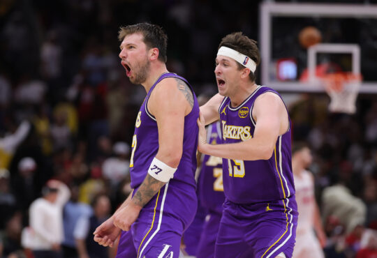 Austin Reaves #15 and Luka Doncic #77 of the Los Angeles Lakers celebrate during the second half against the Houston Rockets at Toyota Center on March 18, 2026.
