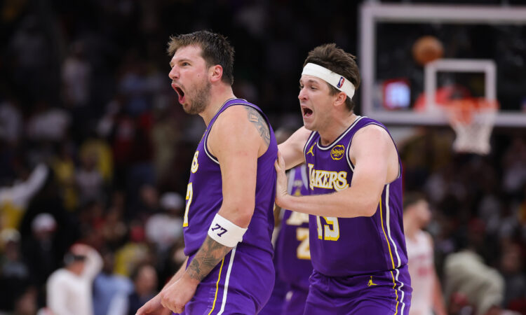 Austin Reaves #15 and Luka Doncic #77 of the Los Angeles Lakers celebrate during the second half against the Houston Rockets at Toyota Center on March 18, 2026.