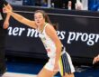 Maddy Siegrist of the Dallas Wings rising for a mid-range jump shot over Napheesa Collier of the Minnesota Lynx.