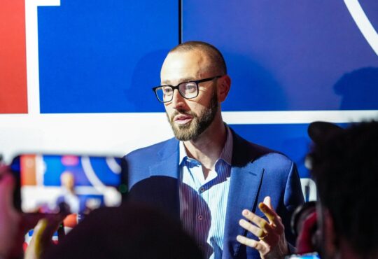 New Dallas Mavericks General Manager Mike Schmitz speaking to reporters after the 2026 NBA Draft Lottery in Chicago.