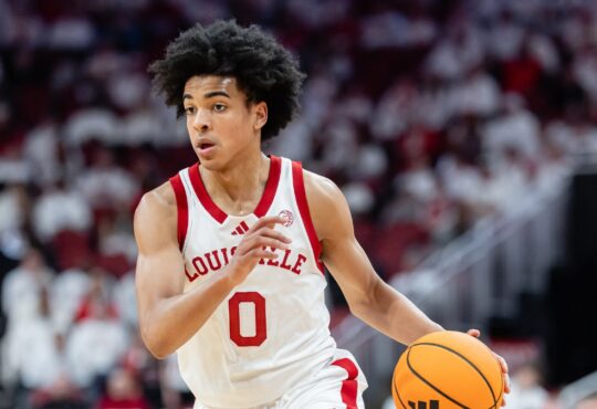 Louisville freshman point guard Mikel Brown Jr. handling the ball along the perimeter against NC State at the KFC Yum! Center.