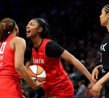 Naz Hillmon (00) of the Atlanta Dream celebrates with Angel Reese (5) during the fourth quarter against the Minnesota Lynx at Target Center.