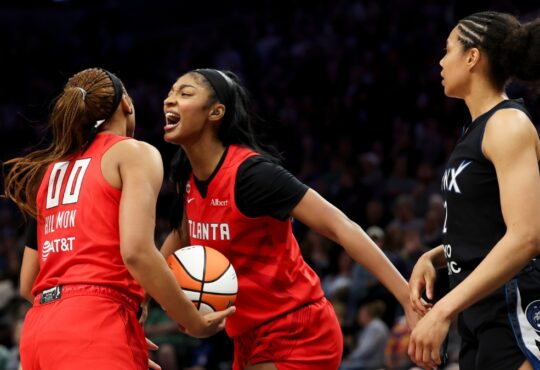 Naz Hillmon (00) of the Atlanta Dream celebrates with Angel Reese (5) during the fourth quarter against the Minnesota Lynx at Target Center.