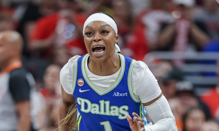 Odyssey Sims (1) of the Dallas Wings reacts during the first half against the Indiana Fever at Gainbridge Fieldhouse.