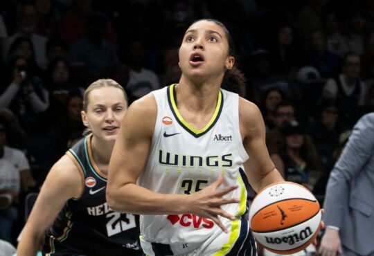 Guard Paige Bueckers and rookie guard Azzi Fudd running the floor together during a fast-break transition sequence at Barclays Center.