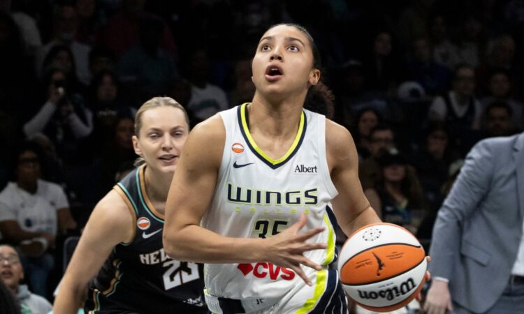 Guard Paige Bueckers and rookie guard Azzi Fudd running the floor together during a fast-break transition sequence at Barclays Center.