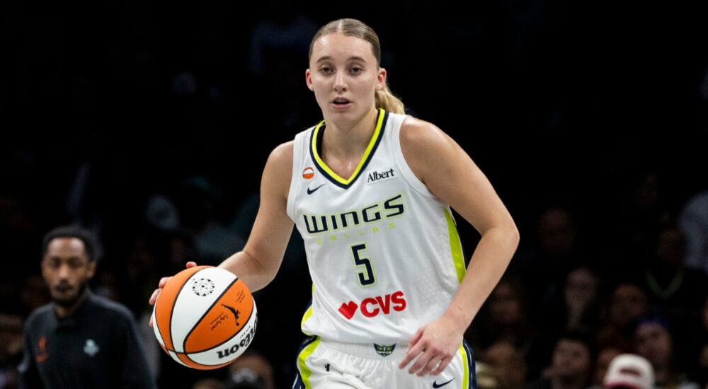 Guard Paige Bueckers dribbling the basketball up the floor in transition during a road game against the New York Liberty.