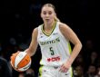 Guard Paige Bueckers dribbling the basketball up the floor in transition during a road game against the New York Liberty.