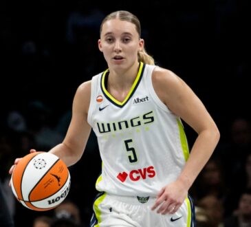 Guard Paige Bueckers dribbling the basketball up the floor in transition during a road game against the New York Liberty.