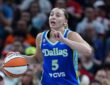 Paige Bueckers (5) of the Dallas Wings brings the ball up the court against the Indiana Fever at Gainbridge Fieldhouse.