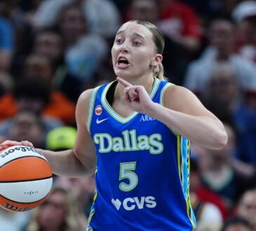 Paige Bueckers (5) of the Dallas Wings brings the ball up the court against the Indiana Fever at Gainbridge Fieldhouse.