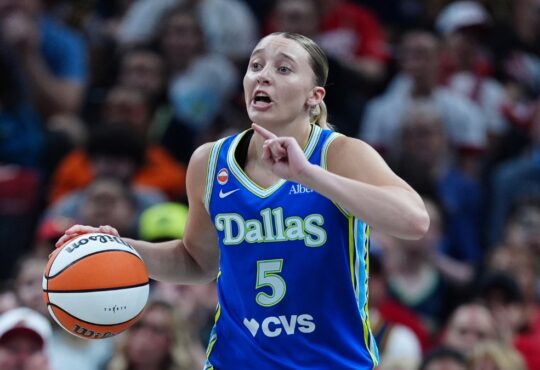 Paige Bueckers (5) of the Dallas Wings brings the ball up the court against the Indiana Fever at Gainbridge Fieldhouse.