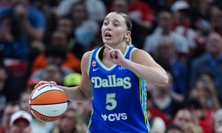 Paige Bueckers (5) of the Dallas Wings brings the ball up the court against the Indiana Fever at Gainbridge Fieldhouse.