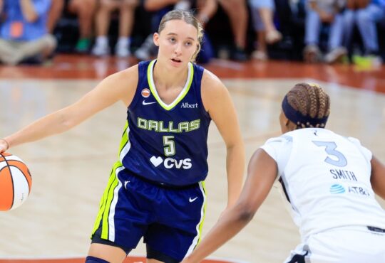 Paige Bueckers of the Dallas Wings dribbles the ball past NaLyssa Smith of the Las Vegas Aces during a preseason game at the Moody Center in Austin.