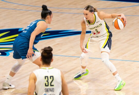 Paige Bueckers of the Dallas Wings sizing up Kayla McBride of the Minnesota Lynx off the dribble at College Park Center.