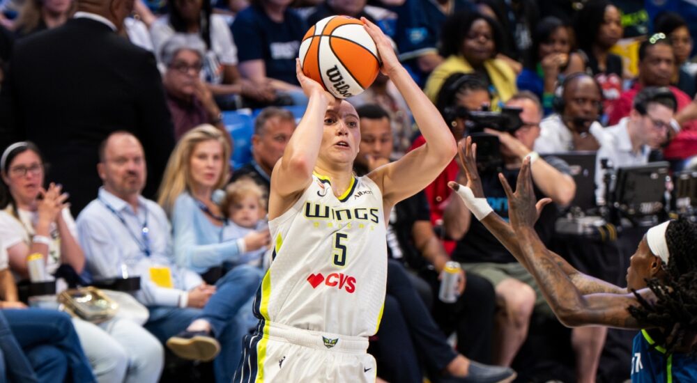 Paige Bueckers of the Dallas Wings rising for a jump shot against the Minnesota Lynx at College Park Center.
