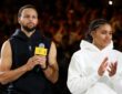 NBA star Stephen Curry and WNBA rookie Azzi Fudd standing together on the court during the 2025 Curry Camp opening training session in Chongqing, China.