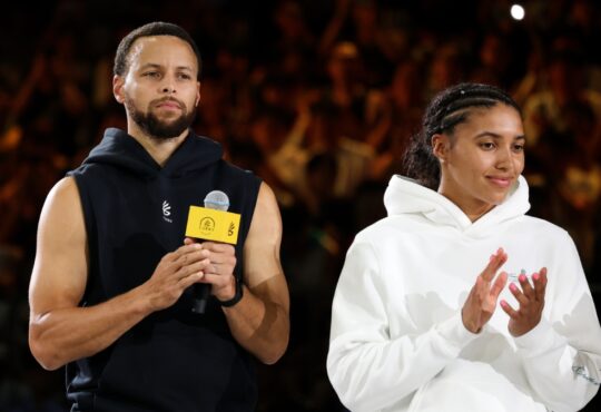 NBA star Stephen Curry and WNBA rookie Azzi Fudd standing together on the court during the 2025 Curry Camp opening training session in Chongqing, China.