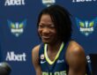 Dulcy Fankam Mendjiadeu posing in her Dallas Wings jersey during 2026 Media Day.