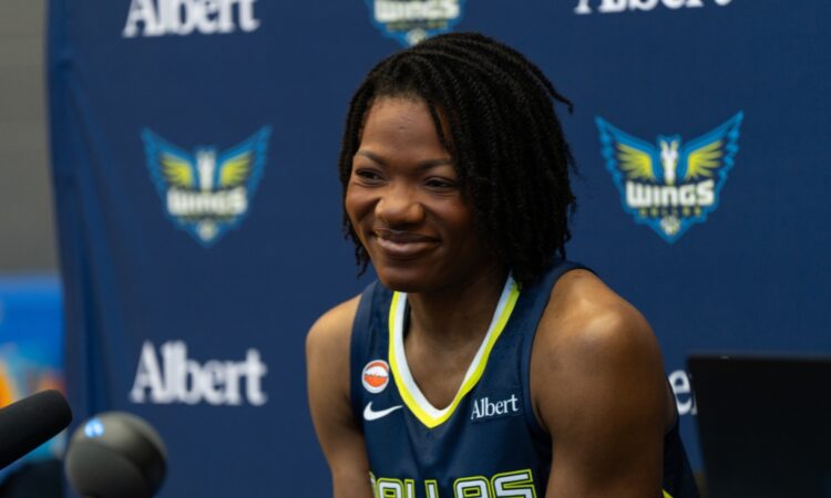 Dulcy Fankam Mendjiadeu posing in her Dallas Wings jersey during 2026 Media Day.