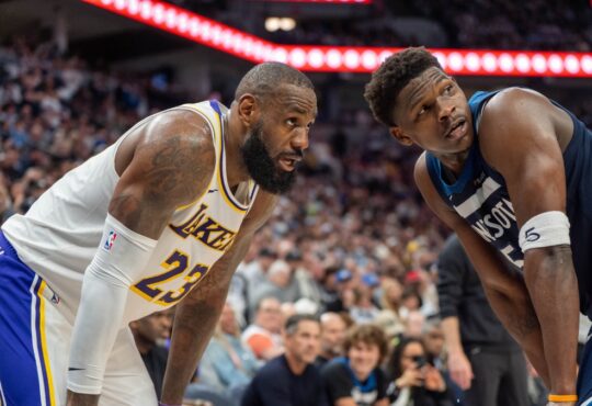 Minnesota Timberwolves guard Anthony Edwards defends Los Angeles Lakers forward LeBron James in the second quarter of Game 4 of the 2025 NBA Playoffs first round at Target Center.