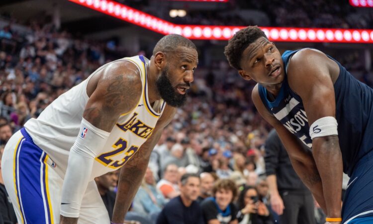 Minnesota Timberwolves guard Anthony Edwards defends Los Angeles Lakers forward LeBron James in the second quarter of Game 4 of the 2025 NBA Playoffs first round at Target Center.