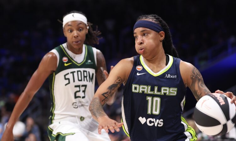 Aziaha James of the Dallas Wings controls the ball in front of Jordan Horston of the Seattle Storm during the fourth quarter at College Park Center.