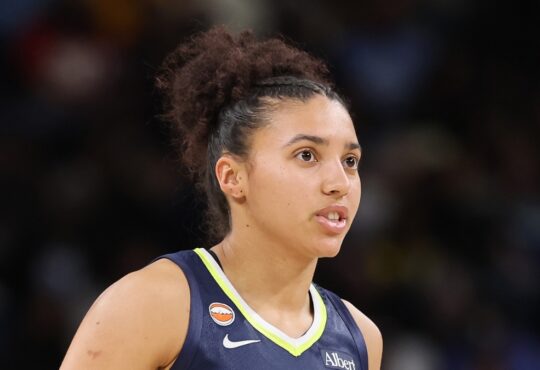 Dallas Wings rookie guard Azzi Fudd (#35) looking on from the court during the second half of a game against the Chicago Sky at Wintrust Arena.