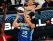 Dallas Wings guard Azzi Fudd shoots over Las Vegas Aces guard Jewell Loyd during a WNBA game at College Park Center in Arlington, Texas, on June 15, 2026.