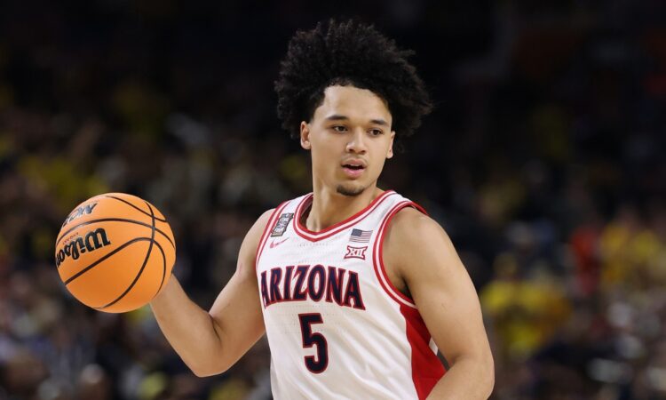 Arizona Wildcats guard Brayden Burries dribbles up the court against Michigan in the 2026 NCAA Final Four.