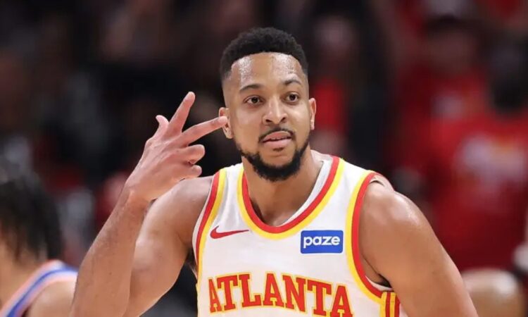 Atlanta Hawks guard CJ McCollum gestures during a game