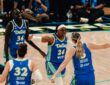 Dallas Wings players Awak Kuier, Jessica Shepard, Arike Ogunbowale, and Paige Bueckers celebrate during a WNBA game against the Las Vegas Aces at College Park Center in Arlington, Texas, on June 15, 2026.